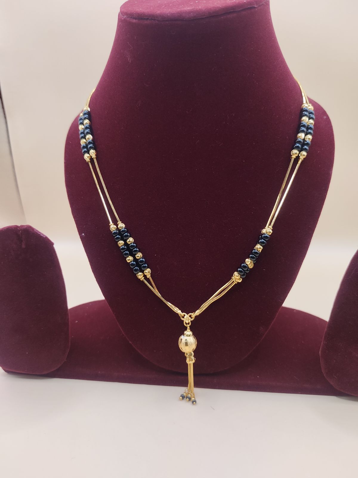 Traditional Black Beads Gold-Finish Chain with Elegant Tassel Pendant