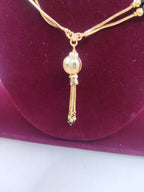 Traditional Black Beads Gold-Finish Chain with Elegant Tassel Pendant