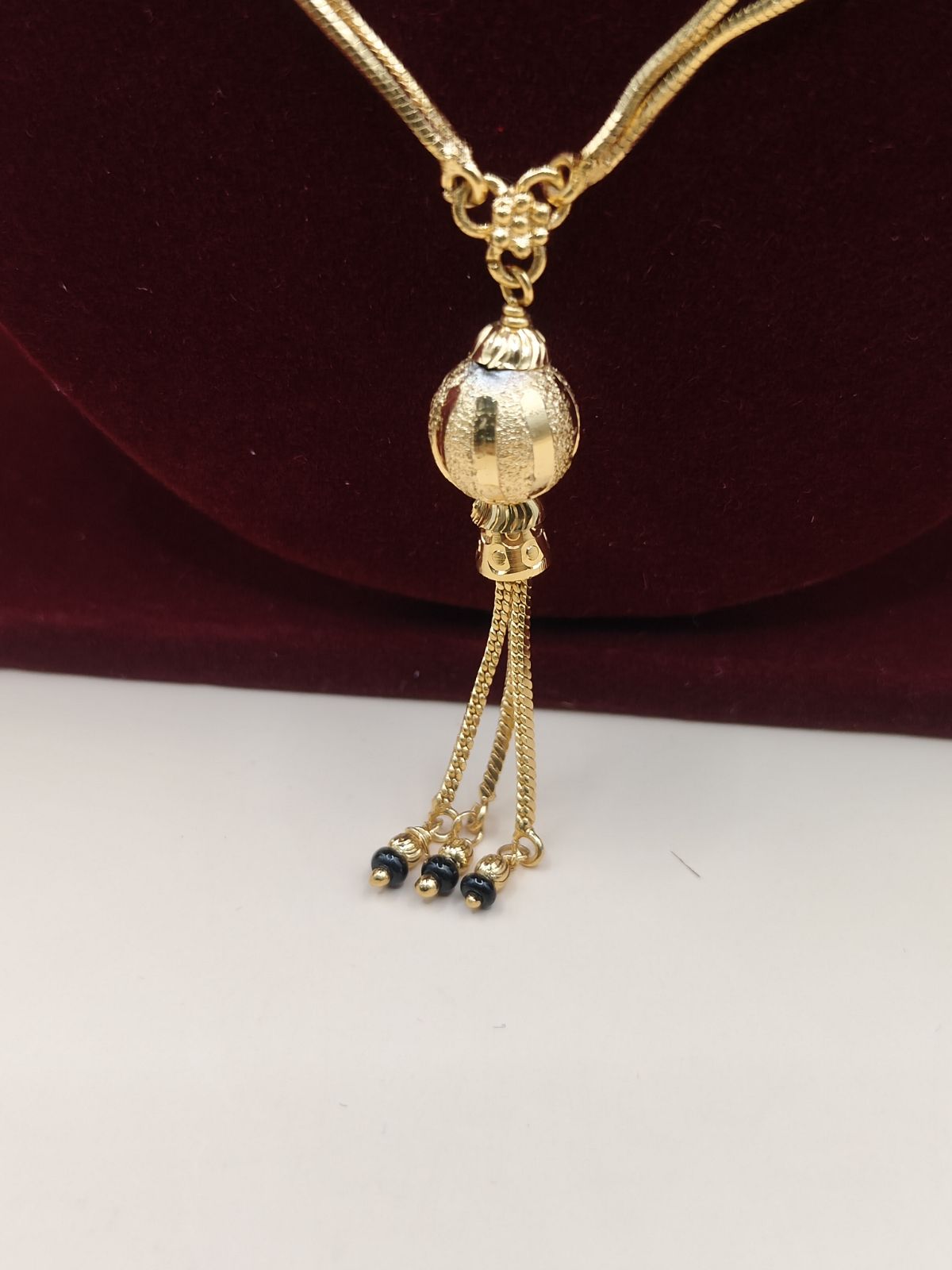 Traditional Black Beads Gold-Finish Chain with Elegant Tassel Pendant