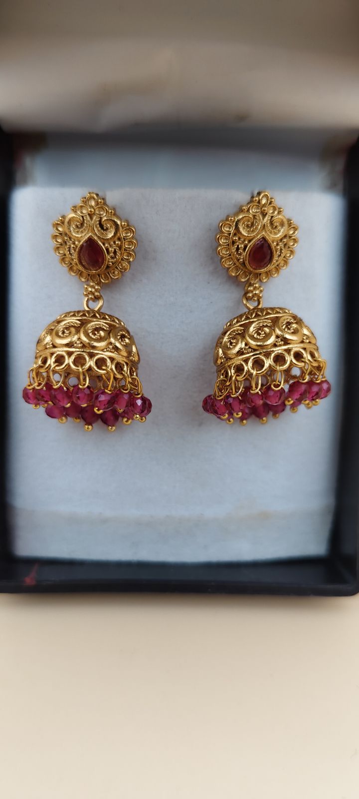 Traditional Gold-Tone Jhumka Earrings with Red Stones