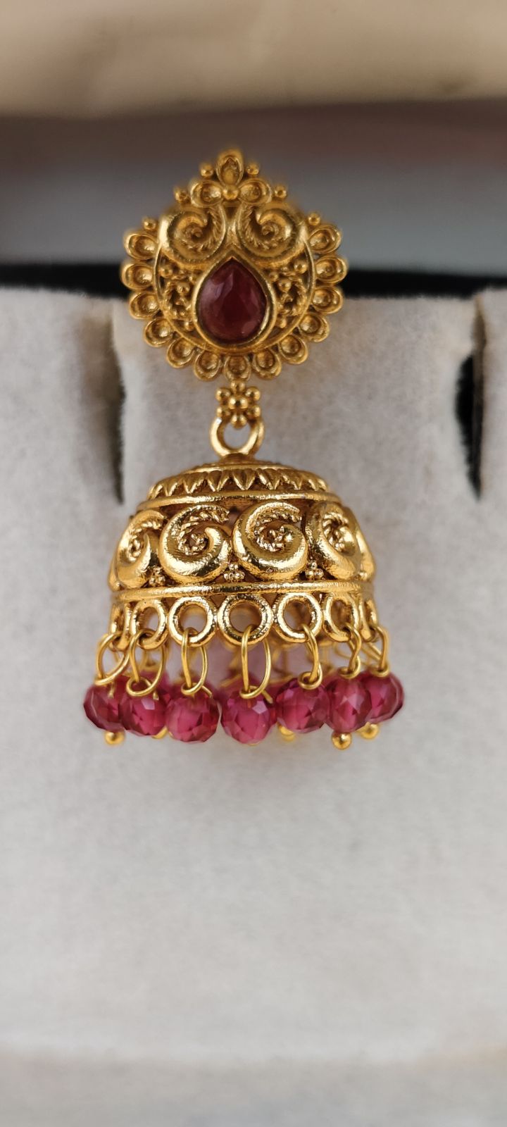 Traditional Gold-Tone Jhumka Earrings with Red Stones