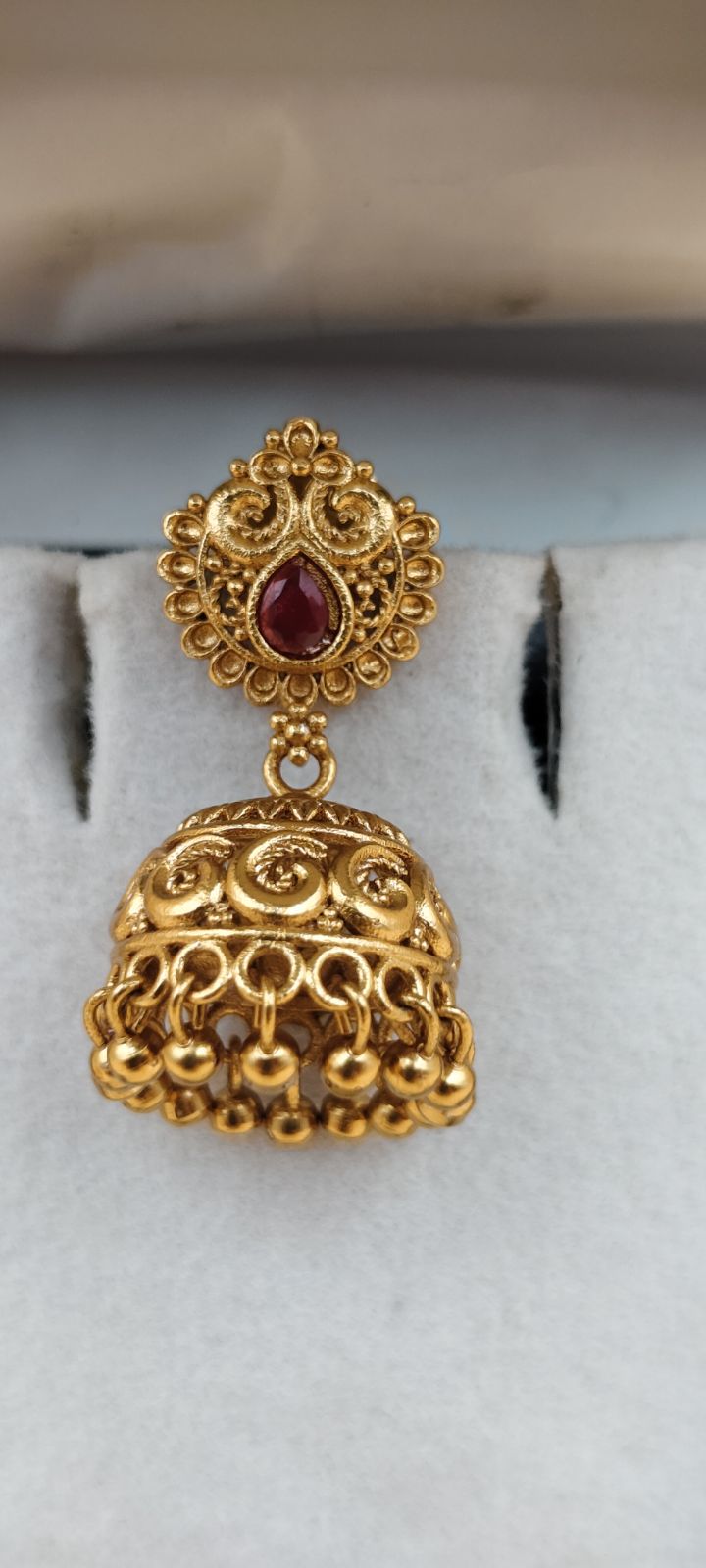 Traditional Gold-Finish Jhumka Earrings with Ruby-Red Stone