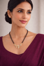 Double-line black beads mangalsutra chain with crystal-studded pendant with drop design.